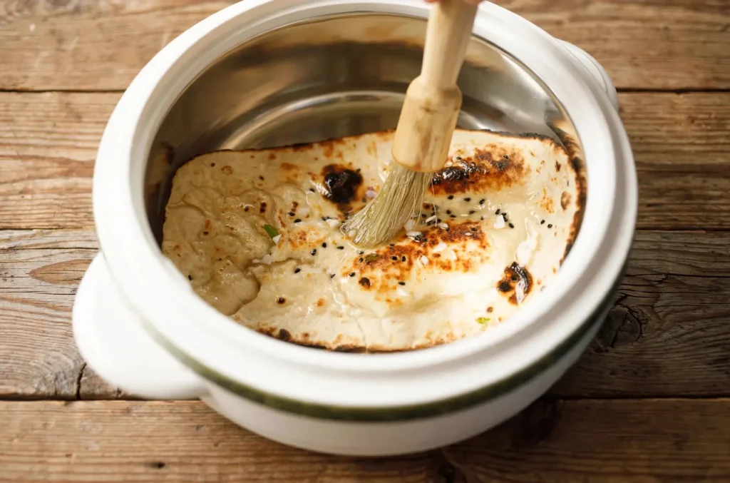 Garlic butter with chopped garlic and coriander in a small pan